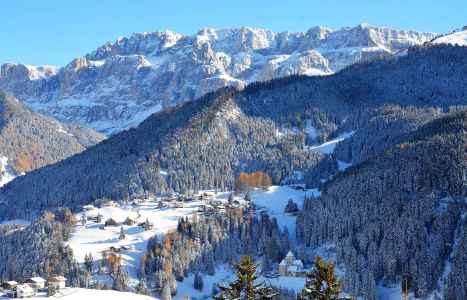 Selva di Val Gardena in winter below the Sella group
