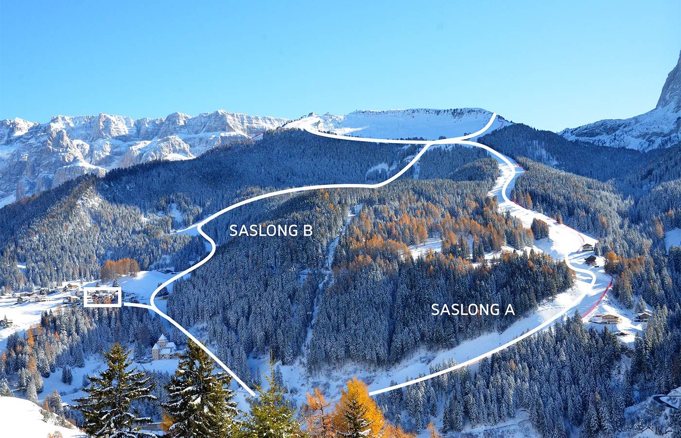 Blick von oben auf Chalet Dlaces und die Skipisten in unmittelbarer Nähe im Winter