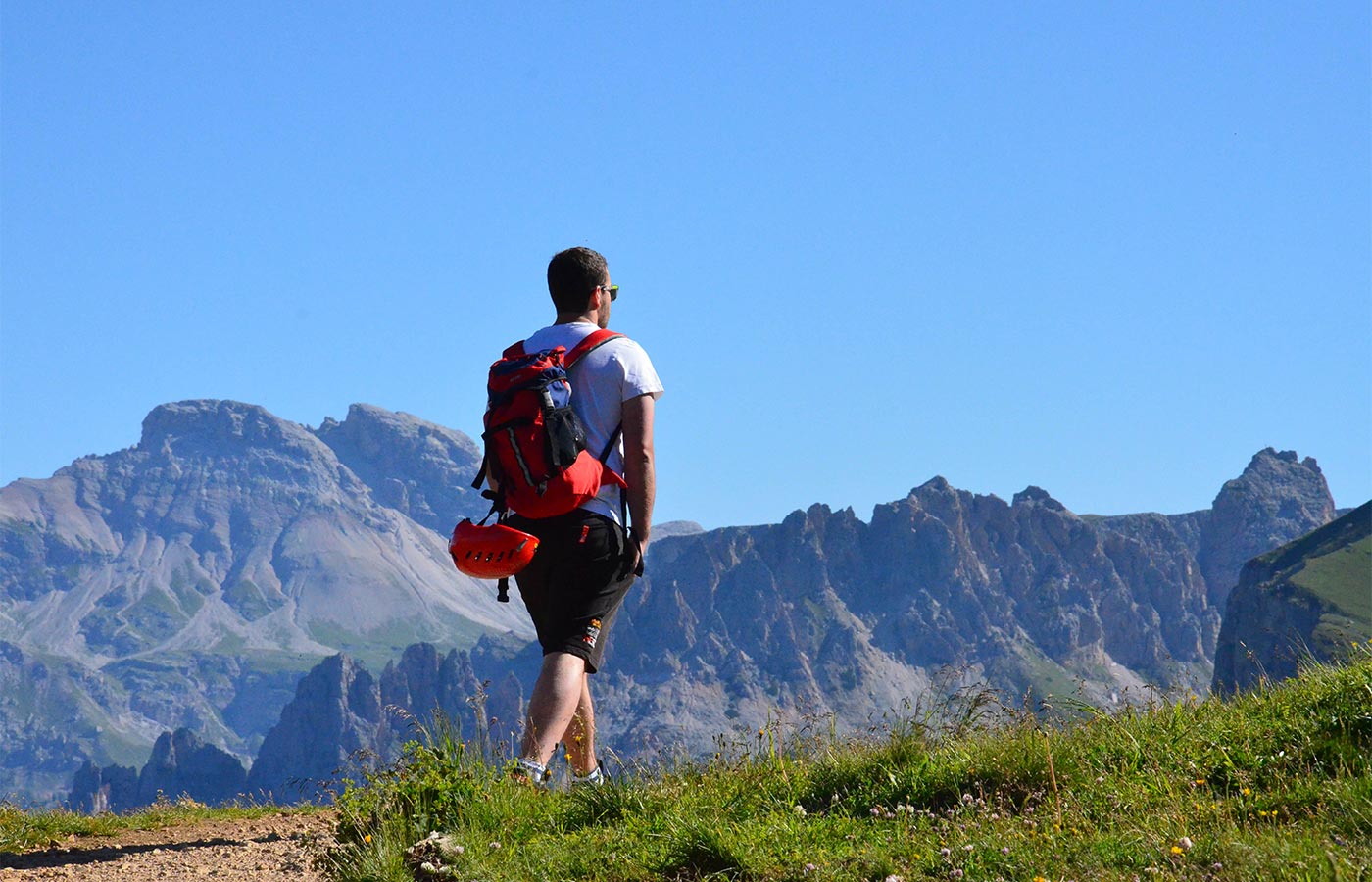 A boy trekking through the mountains